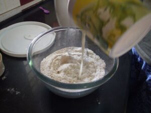 Add milk to flour
